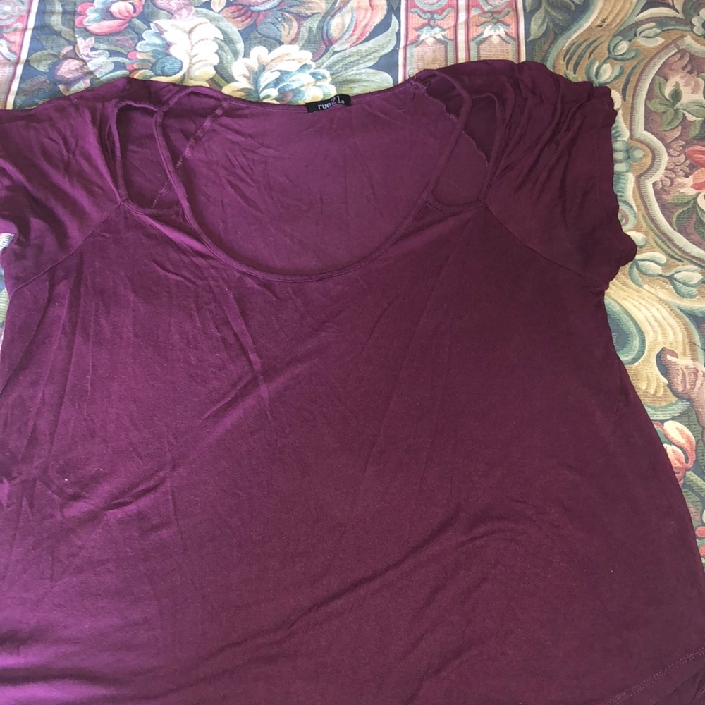 purple shirt with shoulder cutouts